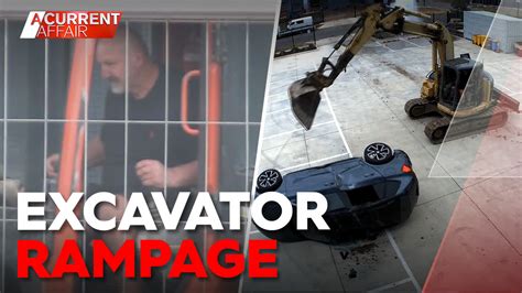 man destroys office with mini excavator|Watch: Man smashes cars in excavator rampage .